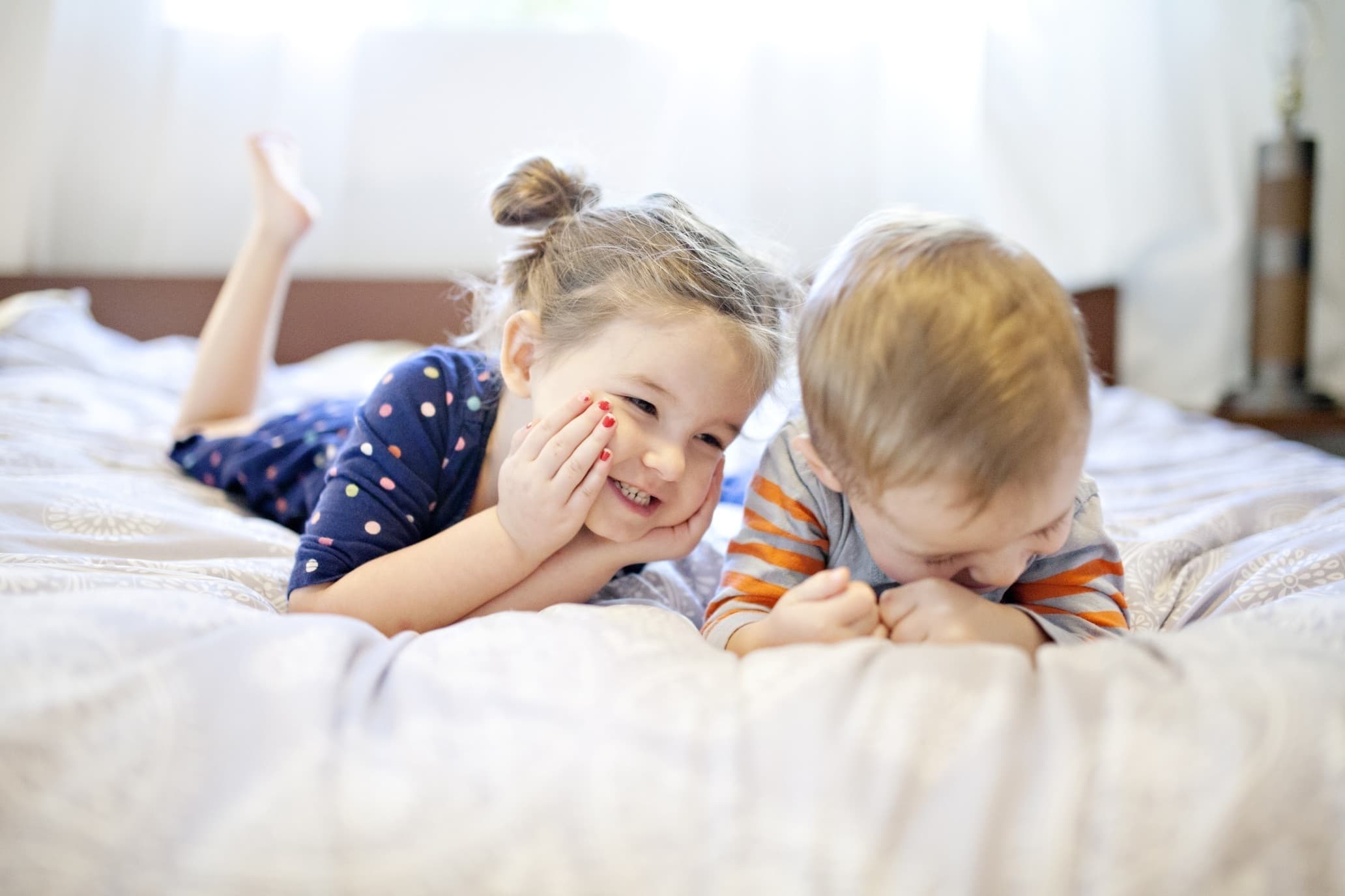 Two little kids laughing
